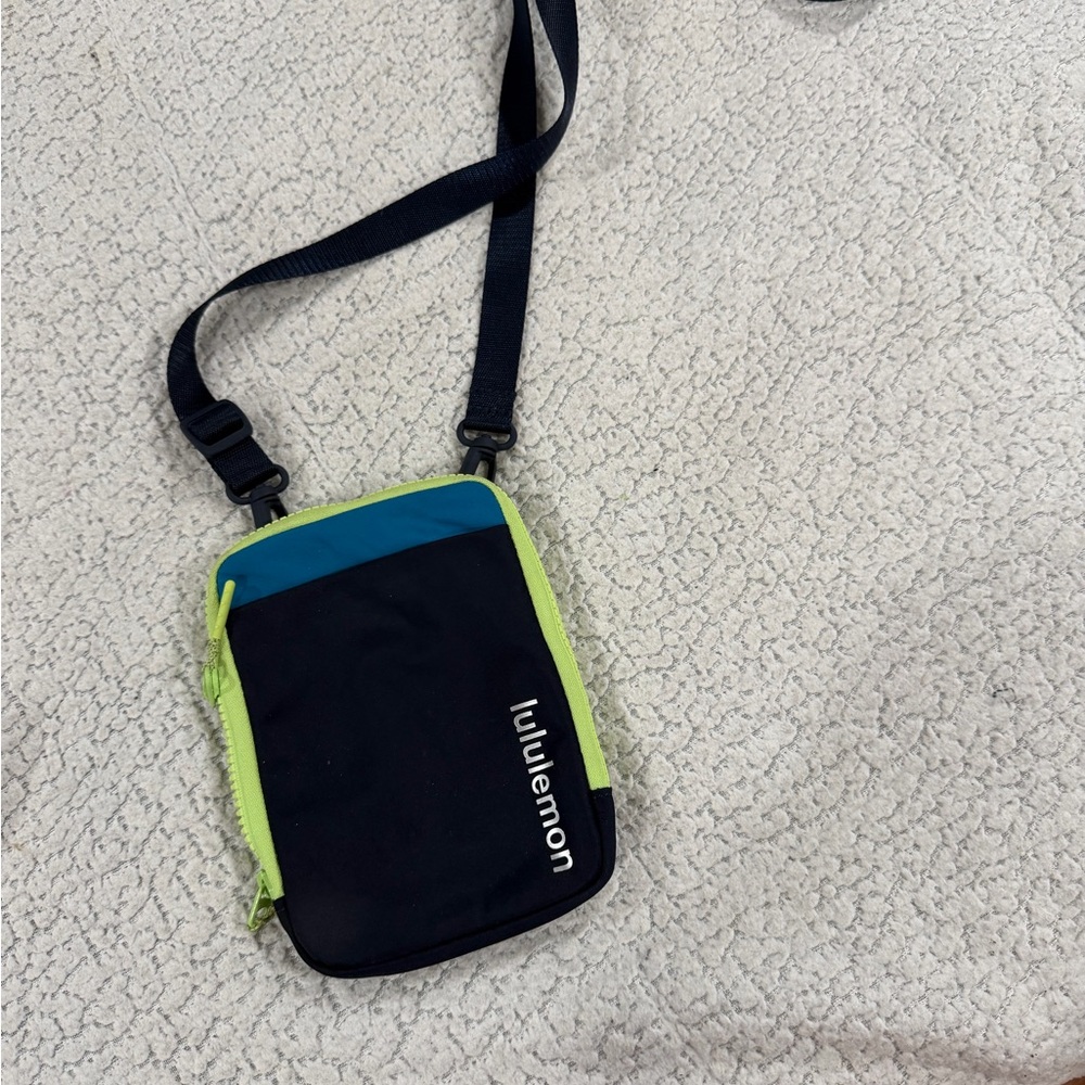 lululemon athletica navy crossbody pouch with teal and lime trim